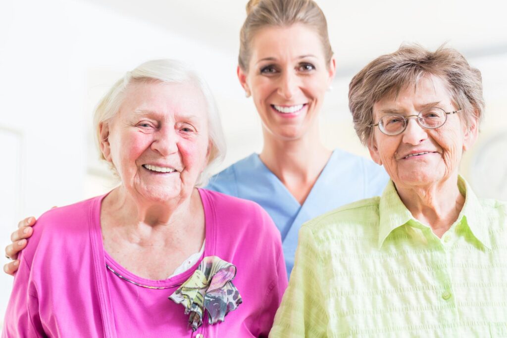 Elderly care nurse with two senior women